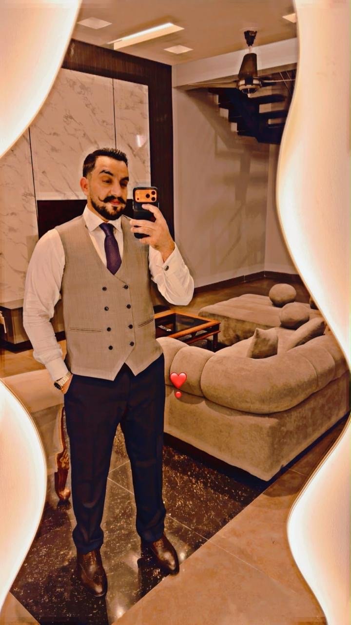 Ahmad Salman in a waistcoat and tie