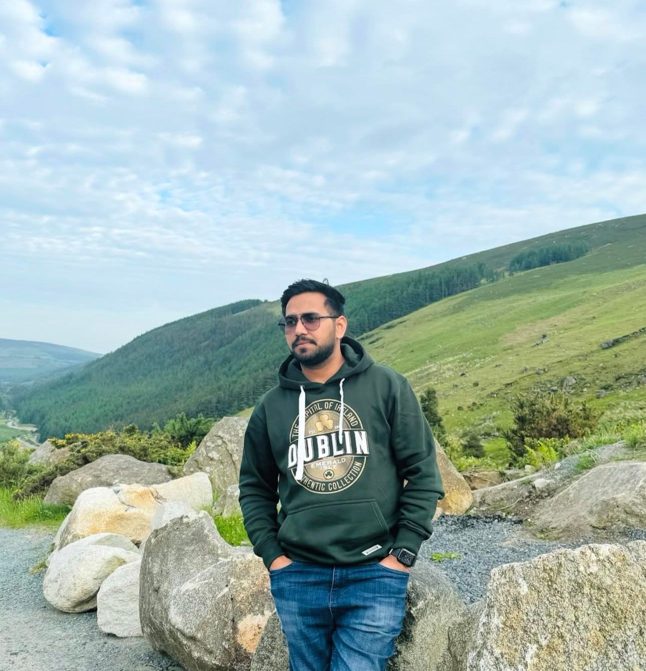 Usmar Saeed wearing a green hoodie outdoors